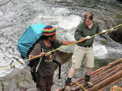 Crossing a log bridge with a personal porter