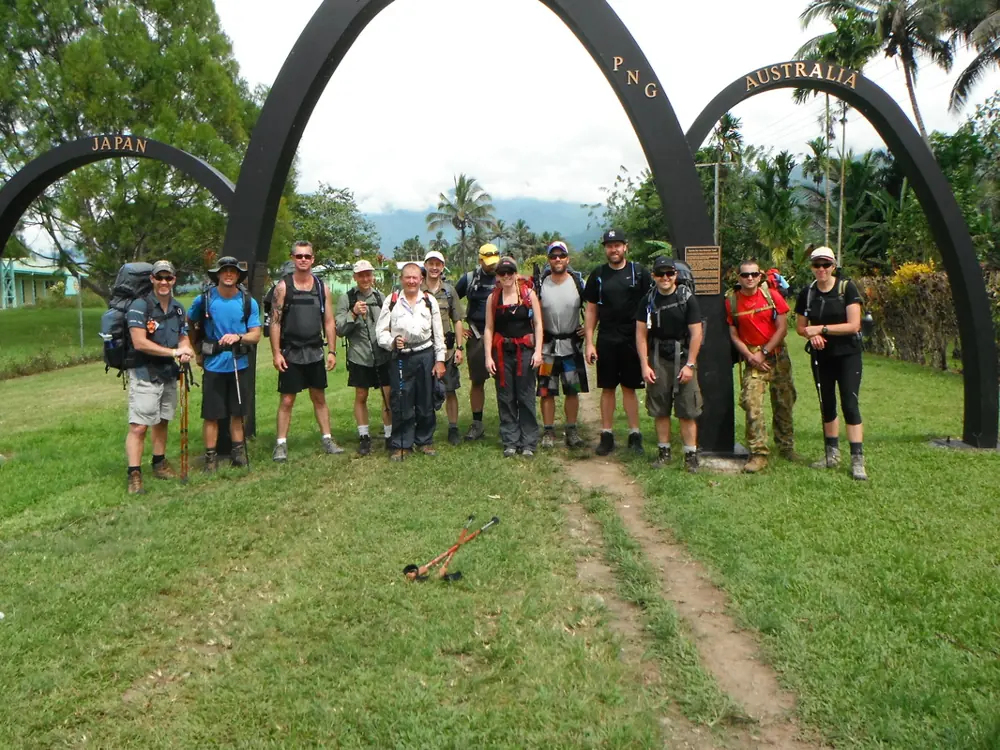 Trekkers at the memorial arch