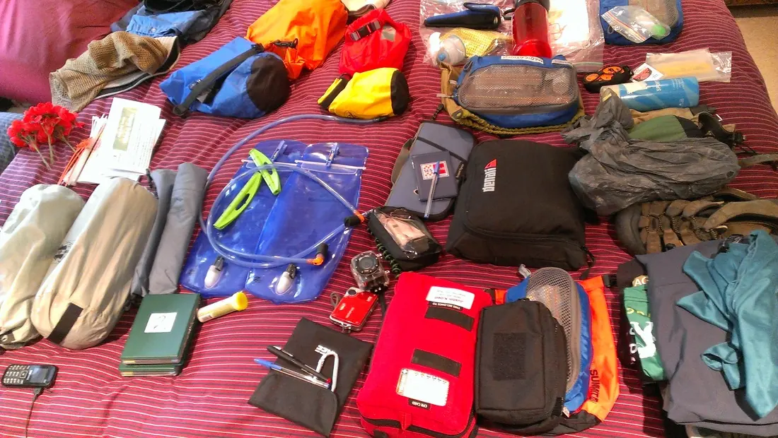 Trekking gear laid out ready for packing