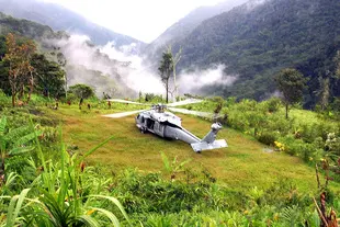 Helicopter landed in a mountain clearing